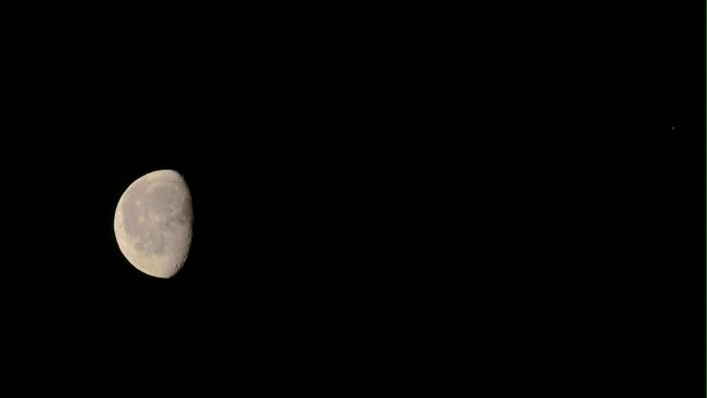 Tokyo, Japan - March 31, 2024:  Rendezvous of the moon and Antares of Scorpius