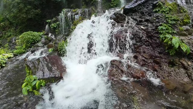 Mountain water flowing clear through the rocks