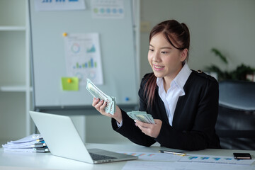 Rich wealthy business woman Asian businesswoman financial bookkeeper girl in an office entrepreneur...