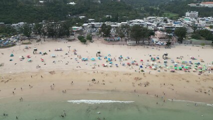 view of visitors at Shek O beach in Hong Kong , March 29 2024