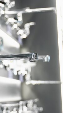 Exhibition showcase in store with faucets for the kitchen and bathroom. Vertical video