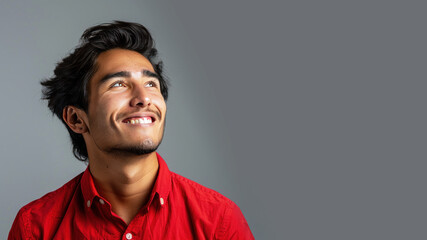 Side view candid of hispanic businessman in red shirt smiling isolated