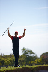 Excited man, celebration and golfer with fist pump for winning, victory or shot in sand pit. Happy...