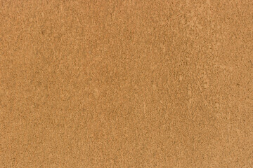 Fototapeta na wymiar Brown sand color rough wall plaster solid surface texture background stucco backdrop pattern