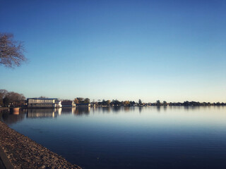 Lake Wendouree Boat Sheds still water on a blue sky day in Ballarat