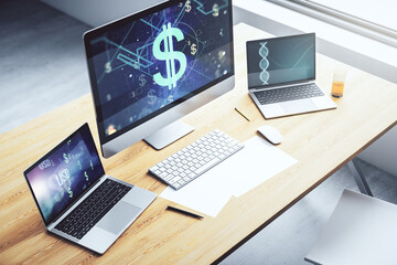 Modern computer monitor with creative USD symbols hologram. Banking and investing concept. 3D...
