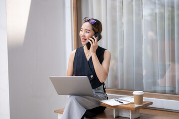 Businesswoman on Phone Call in Bright Office