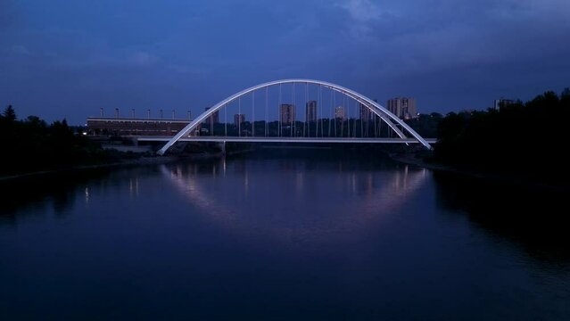 Drone flying over the North Saskatchewan River towards Walterdale Bridge in Edmonton, Canada