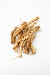 Fresh Taraxacum officinale, the dandelion or common dandelion roots isolated on white background.