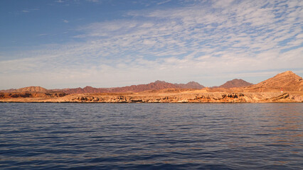 The coast of the Red Sea. Against the background of the Sinai Mountains