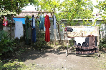 Clothesline drying called jemuran. Hanging outside.