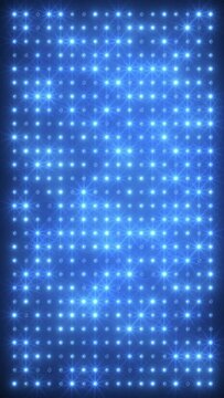 Vertical video animation of an abstract glowing blue LED wall with bright light bulbs - abstract background.