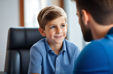 Boy 10 years old talking to a psychologist at a reception, concept of children's psychological problems