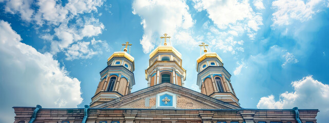 A church with three domes and crosses on top - obrazy, fototapety, plakaty