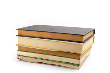 Pile of used books isolated on white background. World book day.