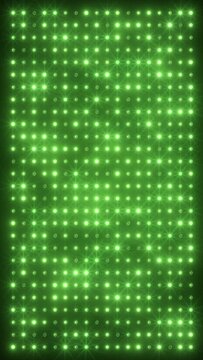 Vertical video animation of an abstract glowing green LED wall with bright light bulbs - abstract background.