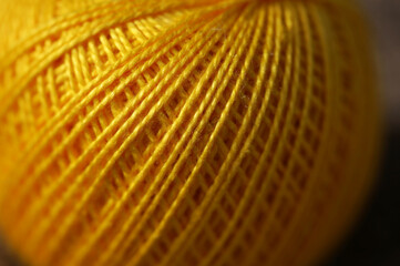 A skein of yellow thread on canvas. Yarn, ball, thread, fluffy, ball, handmade, craft, object, woolen, skein, material, homemade, hobby, traditional, creative