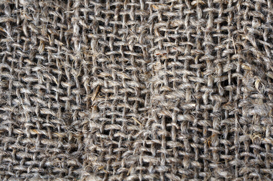 Background canvas fabric. Texture, material, fabric. Plain. Close-up view of rolled kitchen rags. Weaving threads, craft, fluffy, threads, tangled, natural resources