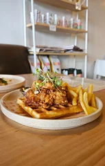 Foto auf Leinwand karaage chicken on waffle with fries and Mayo © Jam-motion