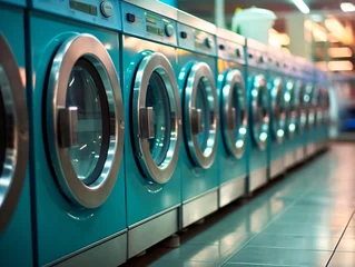 Fotobehang a row of blue washing machines © Stocarp