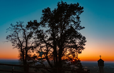 Sunset with a memorial silhouette at Mount Bogenberg, Bogen, Danube, Bavaria, Germany