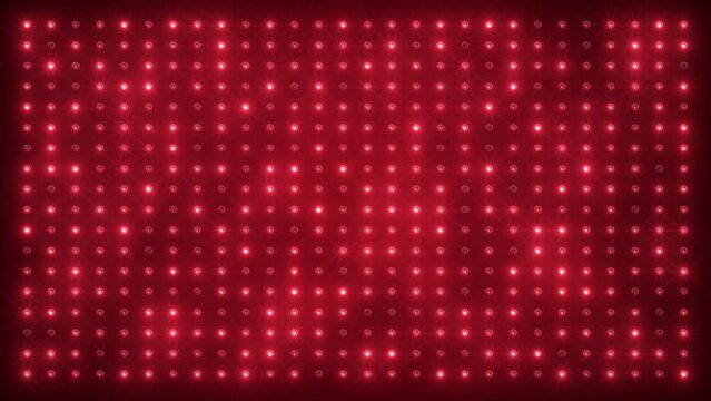 Video animation of an abstract glowing red LED wall with bright light bulbs - abstract background.