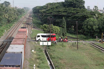 The train passes over the railroad crossing
