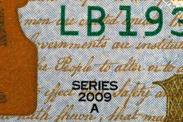 The inscription SERIES 2009 on a one hundred dollar bill. Fragment of a dollar bill. Money paper...