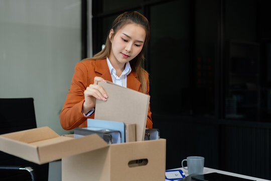 Successful business man, excited young woman packing up in office, job promotion concept, happy working.