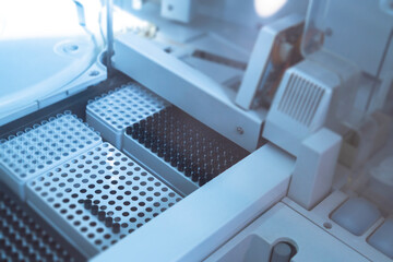 Empty test tubes inside automatic biochemical analyzer. Medical lab equipment biomedical