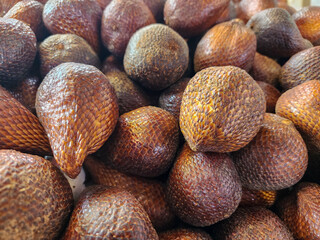 Close up of fresh salak or snake fruit at street market