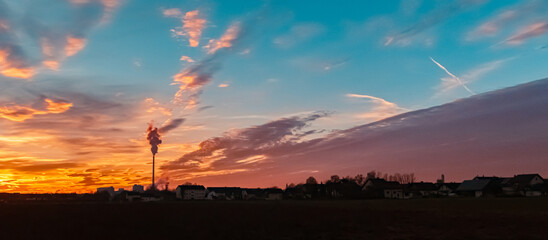 Sunset with a sugar factory silhouette near Plattling, Isar, Deggendorf, Bavaria, Germany