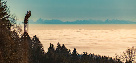 Obraz premium Winter view above the clouds with the alps in about 150 Km distance near Kostenz, Perasdorf, Straubing-Bogen, Bavarian forest, Bavaria, Germany