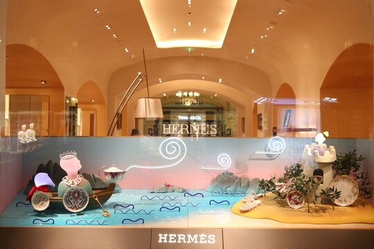 MOSCOW, RUSSIA - AUGUST 9, 2021: Creative show window, store display of Hermes boutique shop in GUM department store in Moscow city (State Department Store). Neon art in show windows. Hermes fashion