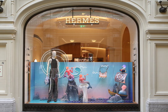 MOSCOW, RUSSIA - AUGUST 9, 2021: Creative show window, store display of Hermes boutique shop in GUM department store in Moscow city (State Department Store). Neon art in show windows. Hermes fashion
