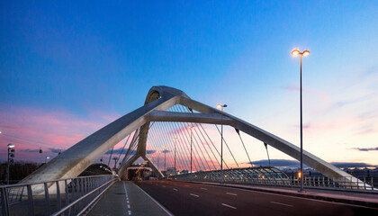 Third millennium bridge in a front view in a purple and blue sunset. Zaragoza, Spain