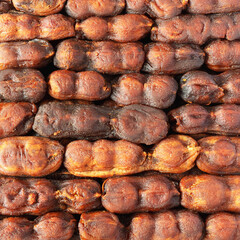 The sweet, spicy pulp of the fruit of the tamarind tree