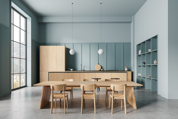 Modern home kitchen interior with eating table and bar island, panoramic window