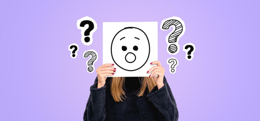 Woman covering face with astonishment placard