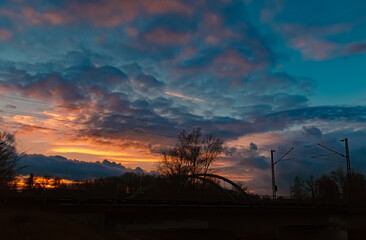 Sunset with a bridge silhouette near Plattling, Isar, Bavaria, Germany