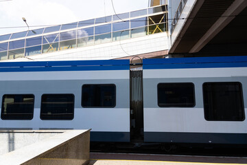 High-speed train at the railway station. Modern passenger train on a railway platform. Railway in Europe. Commercial transport.