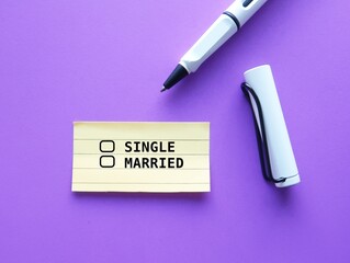 Paper note on purple background with two choices checklists to choose between SINGLE and MARRIED. relationship status concept - love life decision making to stay single or getting married