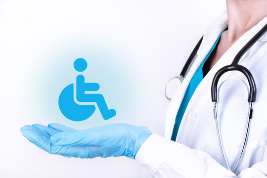 Conceptual image, care for handicapped person.A doctor with a stethoscope holds his hands as a symbol of protection.