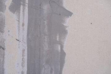 Applying decorative putty. White abstract texture of surface covered with putty. textured...