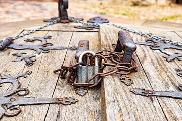 Old forged chain with a lock in the castle Mir, Belarus.