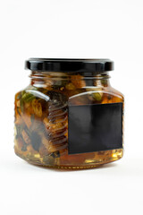 Jar of honey with nuts on white background