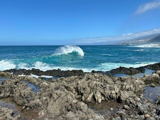 Big blue ocean waves on a sunny day in Los Silos, Tenerife, Canary Islands, Spain 