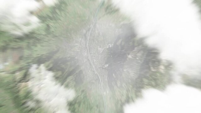 Earth zoom in from space to Schaan, Liechtenstein. Followed by zoom out through clouds and atmosphere into space. Satellite view. Travel intro. Images from NASA