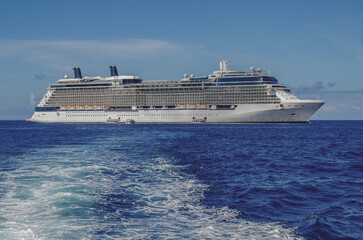 Modern luxury cruiseship cruise ship liner Solstice anchoring in caldera of Hawaii Maui Lahaina...