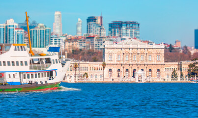 Sea voyage with old ferry (steamboat) on the Bosporus - Dolmabahce palace coastal cityscape with...